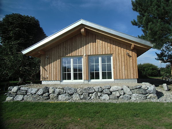 Ein Massivholzhaus bietet viele Vorteile. Foto: Holzbau Völk 